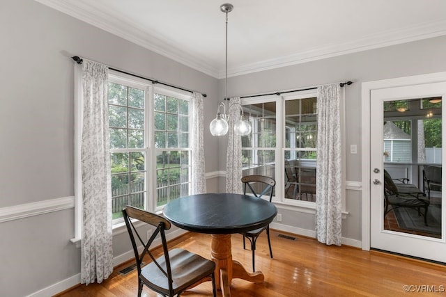15585 Fox Cove Cir, Moseley, VA 23120 - dining area featuring wood finished floors and crown molding