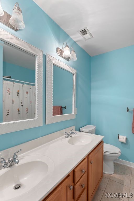 15585 Fox Cove Cir, Moseley, VA 23120 - bathroom with tile patterned floors and double vanity