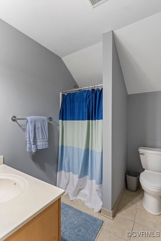 15585 Fox Cove Cir, Moseley, VA 23120 - bathroom featuring vaulted ceiling, tile patterned flooring, vanity, and curtained shower