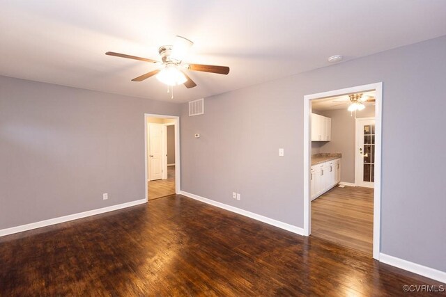 64 Gibbons Ave, Petersburg, VA 23803 - unfurnished room featuring ceiling fan, a smoke detector, and dark wood finished floors