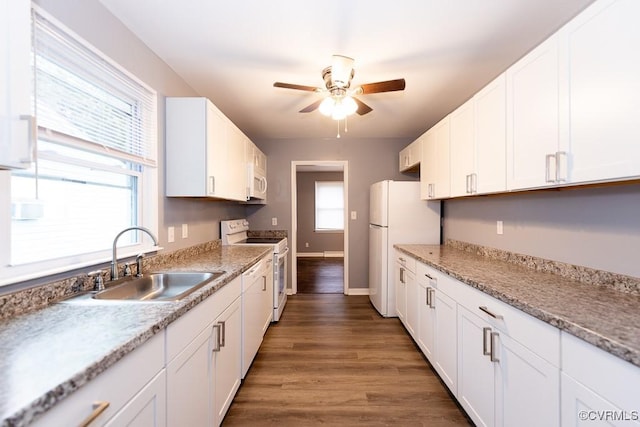 64 Gibbons Ave, Petersburg, VA 23803 - kitchen featuring white appliances, ceiling fan, white cabinetry, and wood finished floors