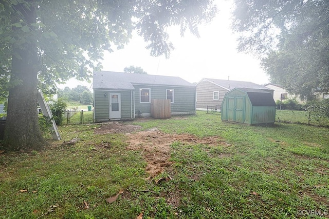 64 Gibbons Ave, Petersburg, VA 23803 - fenced backyard featuring a shed