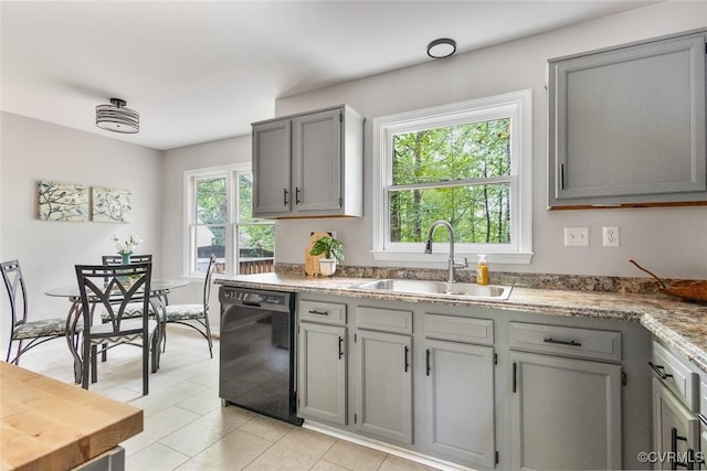 1712 Porters Mill Ln, Midlothian, VA 23114 - kitchen with black dishwasher, gray cabinets, and light tile patterned flooring