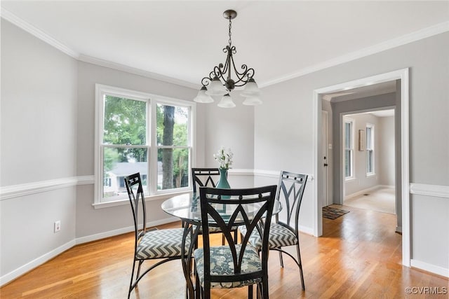 1712 Porters Mill Ln, Midlothian, VA 23114 - dining area with a chandelier, crown molding, and light wood-type flooring