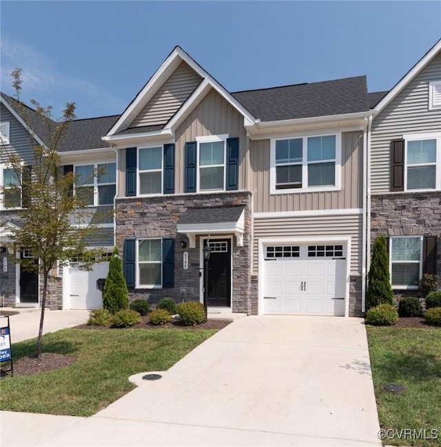 6740 Edith Oaks Way Unit 6740, Chesterfield, VA 23234 - view of front of house featuring stone siding, board and batten siding, concrete driveway, and a garage