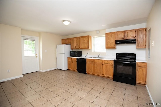 407 E 2nd St, Farmville, VA 23901 - kitchen with black appliances, under cabinet range hood, and light countertops