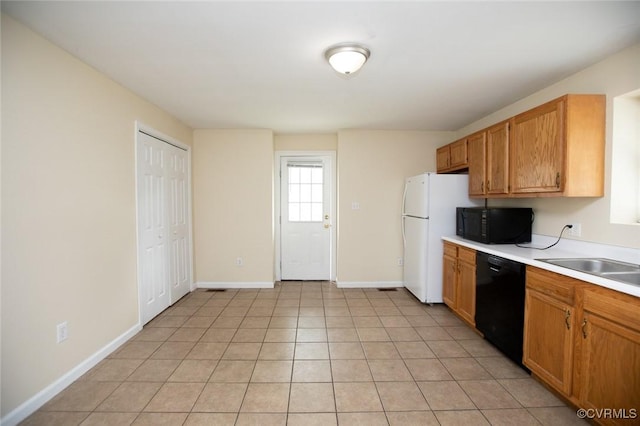 407 E 2nd St, Farmville, VA 23901 - kitchen with black appliances, light countertops, and brown cabinets