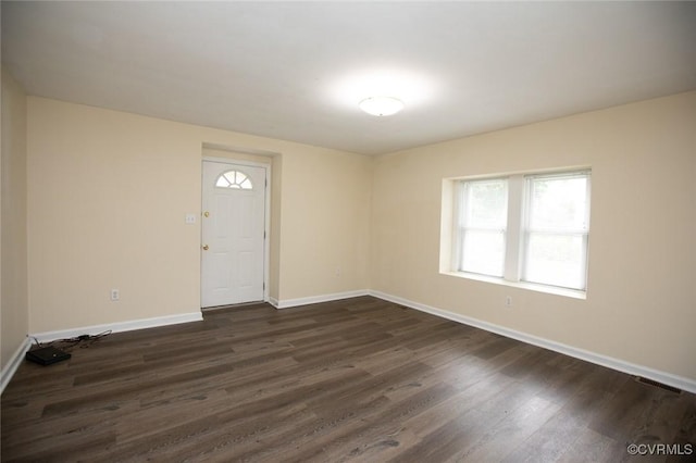 407 E 2nd St, Farmville, VA 23901 - spare room featuring dark wood-style flooring and plenty of natural light
