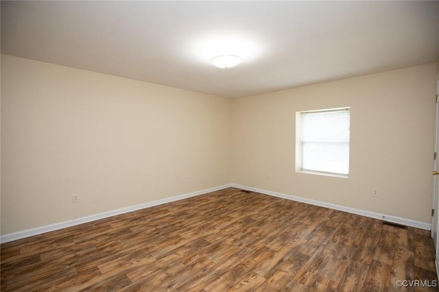 407 E 2nd St, Farmville, VA 23901 - unfurnished room with dark wood finished floors and baseboards