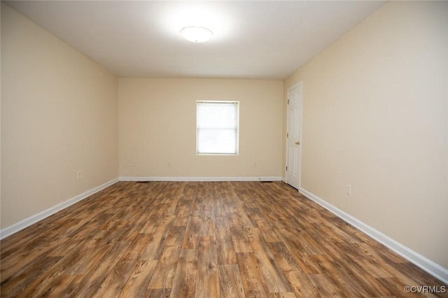 407 E 2nd St, Farmville, VA 23901 - empty room featuring wood finished floors and baseboards