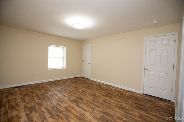 407 E 2nd St, Farmville, VA 23901 - spare room featuring dark wood-style flooring and a smoke detector