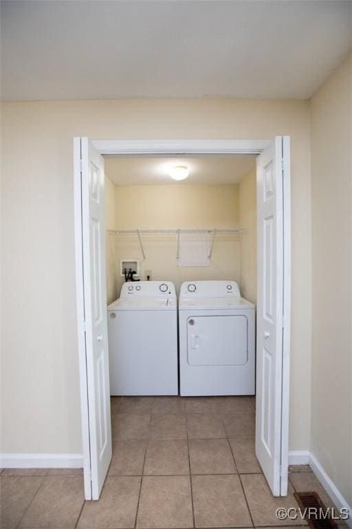 407 E 2nd St, Farmville, VA 23901 - washroom featuring washer and dryer and light tile patterned floors