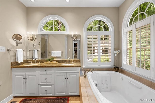 5911 Waters Edge Rd, Midlothian, VA 23112 - bathroom featuring double vanity, a whirlpool tub, and tile patterned floors