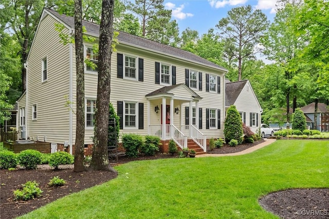 5911 Waters Edge Rd, Midlothian, VA 23112 - colonial house featuring a front lawn
