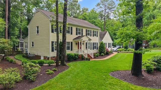 5911 Waters Edge Rd, Midlothian, VA 23112 - colonial home featuring a front yard, crawl space, and view of wooded area