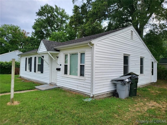 527 Price St, Hampton, VA 23663 - view of side of property with a lawn and a shingled roof