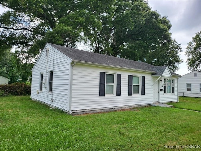 527 Price St, Hampton, VA 23663 - view of front of house with a front yard and roof with shingles