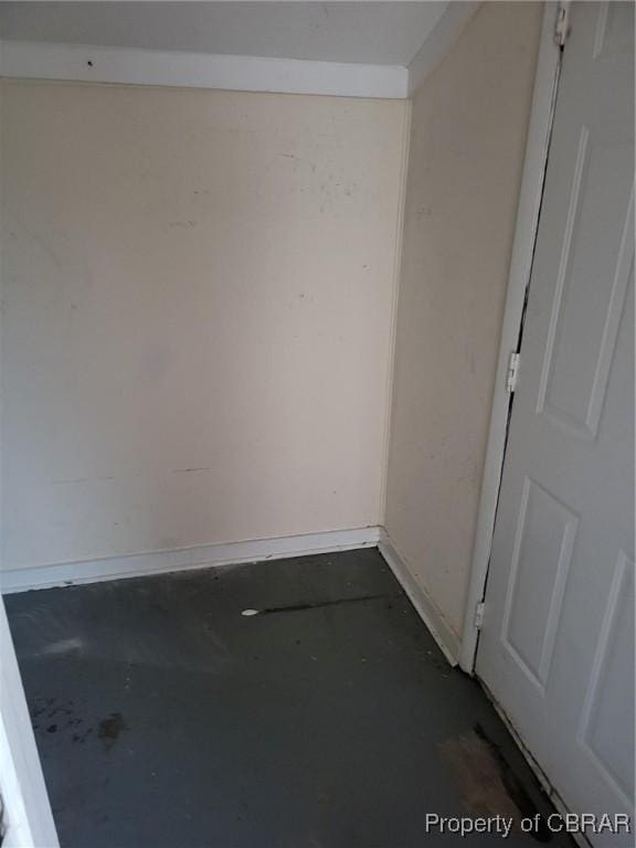 527 Price St, Hampton, VA 23663 - empty room featuring unfinished concrete floors and baseboards