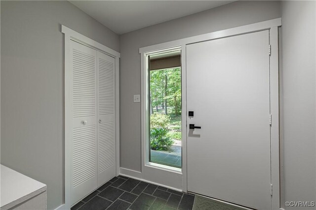 9312 Groundhog, Chesterfield, VA 23235 - entryway featuring dark tile patterned flooring and baseboards
