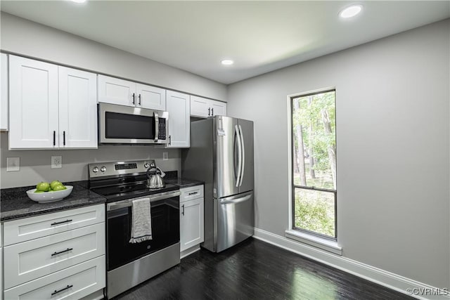 9312 Groundhog, Chesterfield, VA 23235 - kitchen with stainless steel appliances, white cabinets, dark wood-type flooring, dark stone counters, and recessed lighting