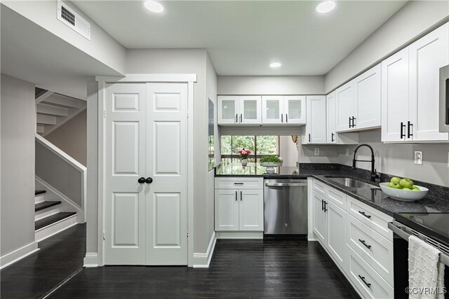 9312 Groundhog, Chesterfield, VA 23235 - kitchen featuring stainless steel dishwasher, white cabinetry, dark stone countertops, recessed lighting, and dark wood-style floors