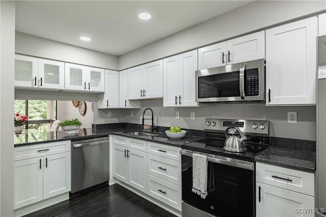 9312 Groundhog, Chesterfield, VA 23235 - kitchen with appliances with stainless steel finishes, white cabinets, dark stone counters, glass insert cabinets, and recessed lighting