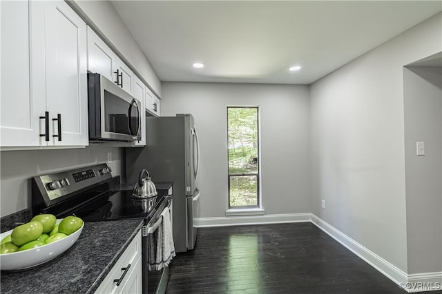 9312 Groundhog, Chesterfield, VA 23235 - kitchen featuring appliances with stainless steel finishes, dark wood-type flooring, white cabinets, dark stone counters, and recessed lighting