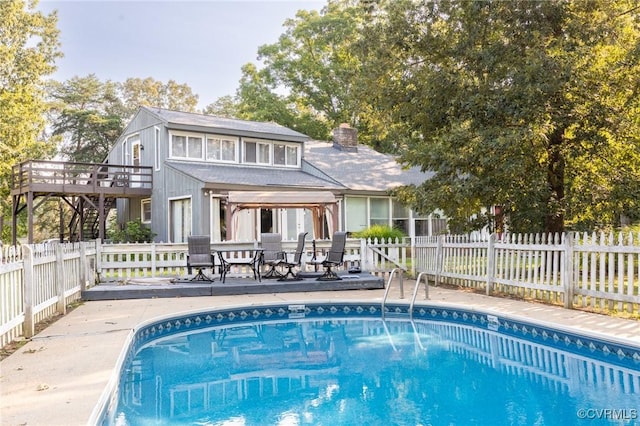 17009 Faithful Run, Montpelier, VA 23192 - view of swimming pool featuring a wooden deck, a fenced backyard, stairway, and a patio area