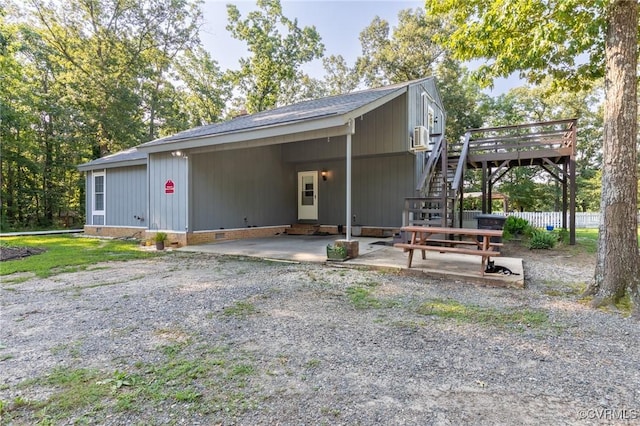 17009 Faithful Run, Montpelier, VA 23192 - view of front of home featuring crawl space, gravel driveway, an attached carport, a deck, and stairs