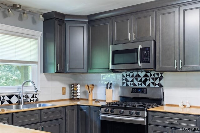 17009 Faithful Run, Montpelier, VA 23192 - kitchen featuring stainless steel appliances, tasteful backsplash, and light countertops