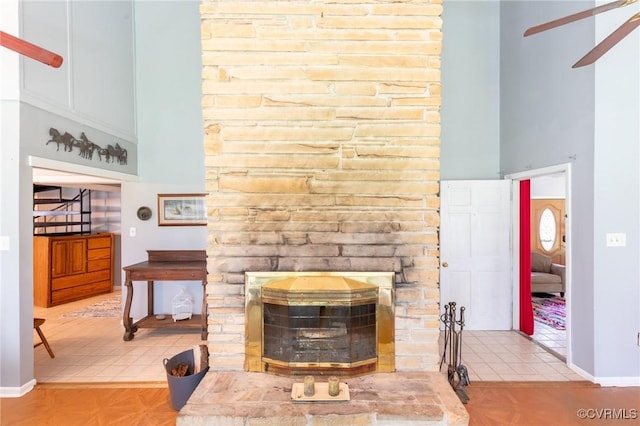 17009 Faithful Run, Montpelier, VA 23192 - living room featuring ceiling fan, a fireplace, and a towering ceiling