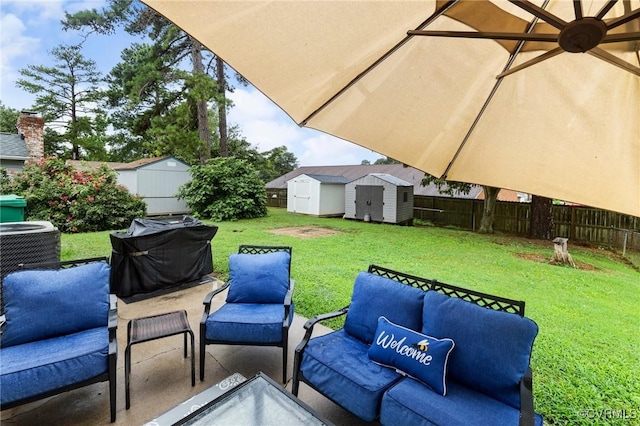 204 Prince Albert Ave, Colonial Heights, VA 23834 - fenced backyard featuring a shed, a grill, an outdoor hangout area, and a patio