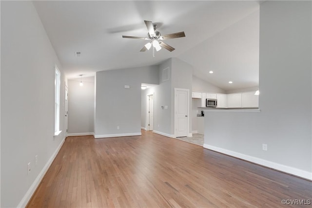 68 Halls Store Rd, Mineral, VA 23117 - unfurnished living room featuring ceiling fan, light wood-style floors, and high vaulted ceiling