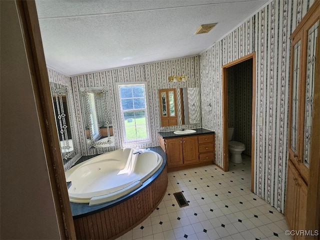 467 Oakland Rd, Farnham, VA 22460 - full bathroom with wallpapered walls, vanity, a bath, and a textured ceiling