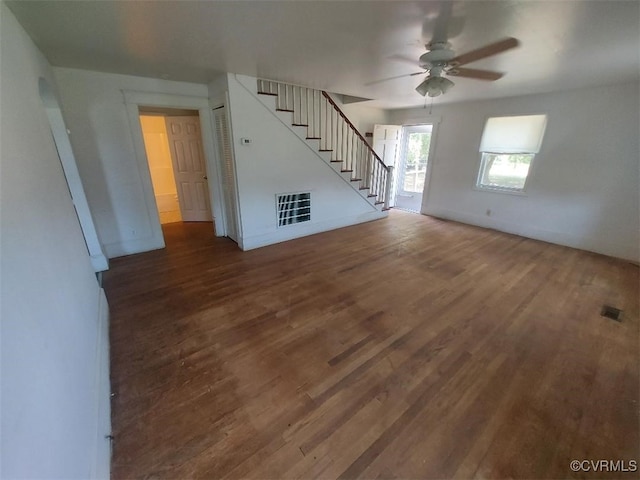 4870 E Water View Rd, Water View, VA 23180 - unfurnished living room with stairway, a ceiling fan, and wood finished floors