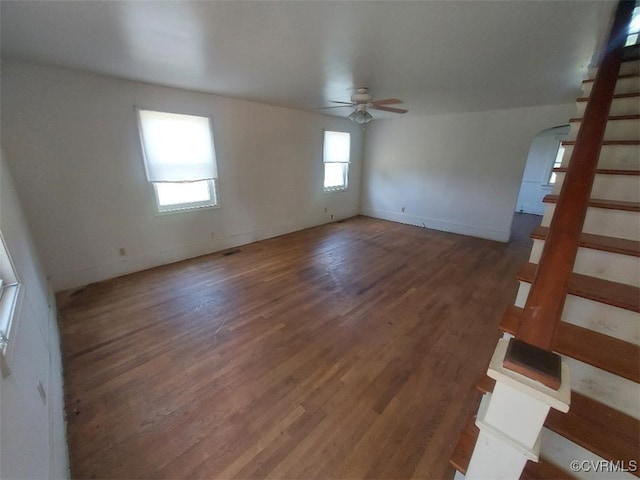 4870 E Water View Rd, Water View, VA 23180 - spare room featuring stairway, ceiling fan, wood finished floors, and arched walkways