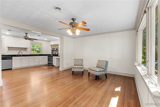 6482 Robin Way, Mechanicsville, VA 23111 - sitting room featuring decorative columns, ceiling fan, light wood-style floors, and crown molding