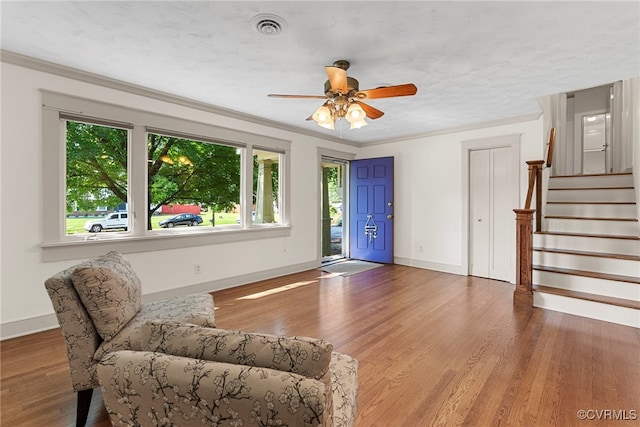 6482 Robin Way, Mechanicsville, VA 23111 - entrance foyer with plenty of natural light, a ceiling fan, wood finished floors, stairway, and crown molding