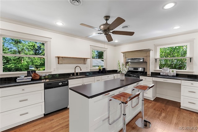 6482 Robin Way, Mechanicsville, VA 23111 - kitchen with stainless steel appliances, dark countertops, healthy amount of natural light, crown molding, and recessed lighting