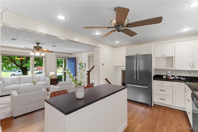 6482 Robin Way, Mechanicsville, VA 23111 - kitchen featuring appliances with stainless steel finishes, ceiling fan, dark countertops, white cabinetry, and crown molding
