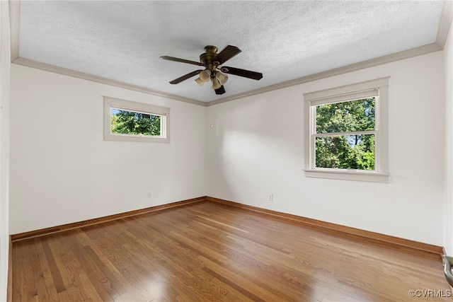 6482 Robin Way, Mechanicsville, VA 23111 - spare room featuring healthy amount of natural light, a textured ceiling, wood finished floors, ceiling fan, and ornamental molding