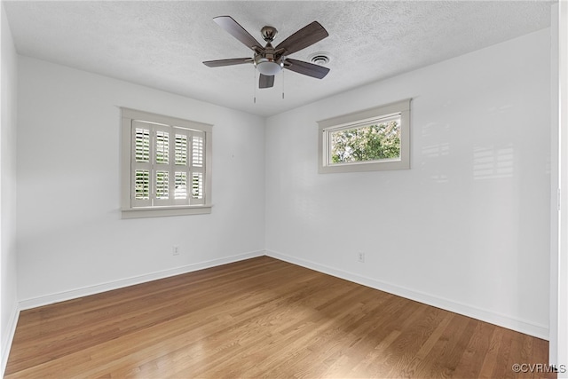 6482 Robin Way, Mechanicsville, VA 23111 - spare room with plenty of natural light, light wood finished floors, a ceiling fan, and a textured ceiling