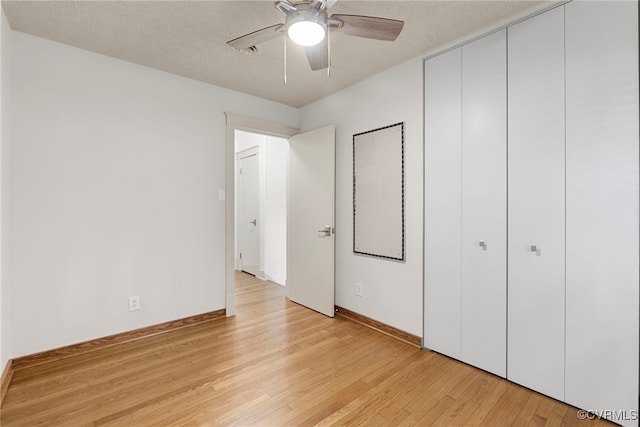 6482 Robin Way, Mechanicsville, VA 23111 - unfurnished bedroom with light wood-type flooring, a closet, and a ceiling fan
