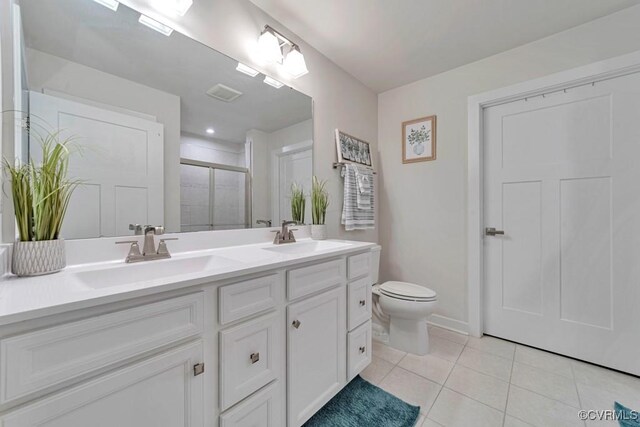 5812 Addison Gate Dr, North Chesterfield, VA 23234 - bathroom featuring a stall shower, double vanity, and tile patterned flooring