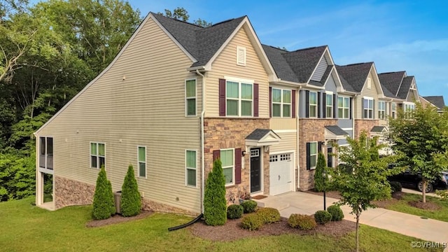 5812 Addison Gate Dr, North Chesterfield, VA 23234 - traditional home with stone siding, concrete driveway, a front lawn, and an attached garage