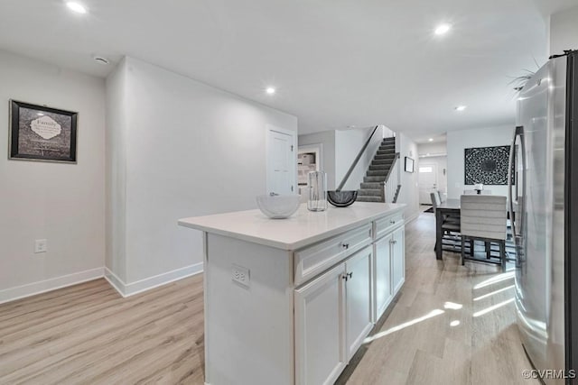 5812 Addison Gate Dr, North Chesterfield, VA 23234 - kitchen featuring freestanding refrigerator, light wood finished floors, a center island, white cabinetry, and recessed lighting