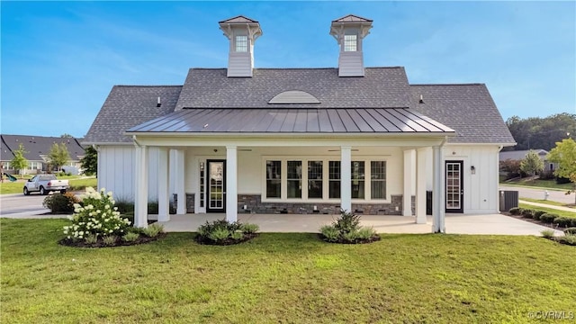 5812 Addison Gate Dr, North Chesterfield, VA 23234 - back of house with a standing seam roof, board and batten siding, and a yard