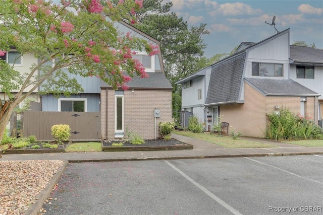 164 Lake One Dr, Hampton, VA 23666 - view of front of house with brick siding, uncovered parking, and a shingled roof