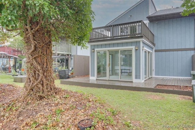 164 Lake One Dr, Hampton, VA 23666 - rear view of property featuring a balcony, a lawn, and a patio area