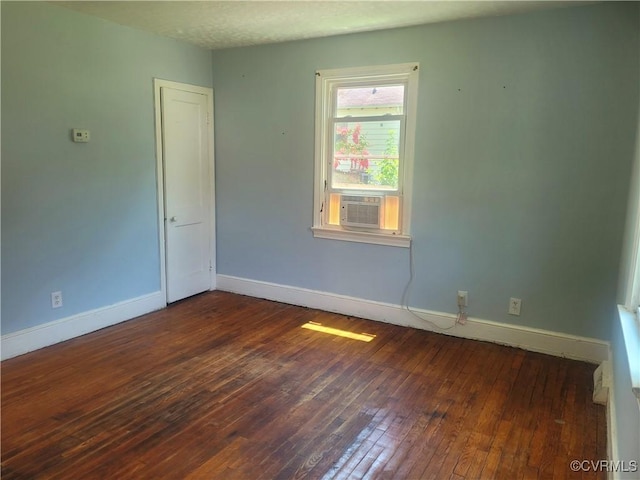 1227 Hilton Pl, Petersburg, VA 23803 - empty room with dark wood finished floors and cooling unit